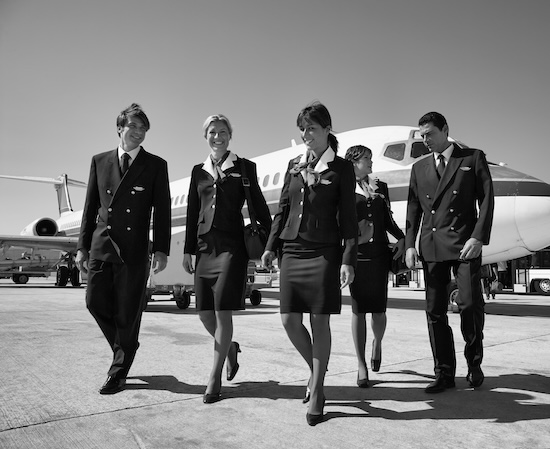 Italy, Sardinia, Olbia International Airport, flight assistants near an airplane @ credit Depositphotos