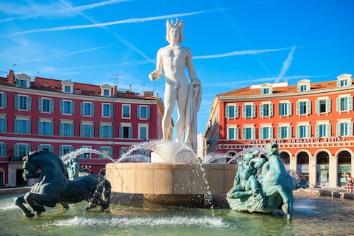 Nice, Apollo statue and Fountain of the Sun at the Place Massena square in Nice city, Cote d'Azur region in France @ credit Depositphotos