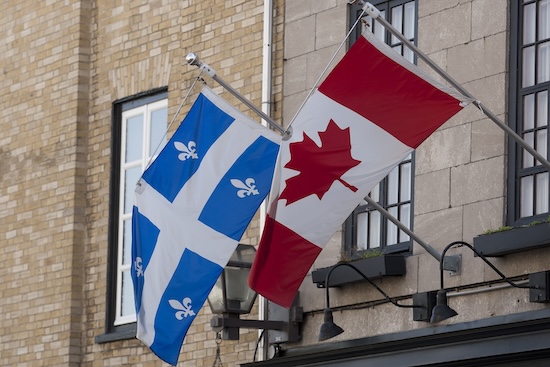 Flags of Quebec and Canada @ credit Depositphotos