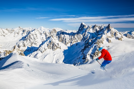 Skiing Vallee Blanche Chamonix with amazing panorama of Grandes Jorasses and Dent du Geant from Aiguille du Midi, Mont Blanc mountain, Haute-Savoie, France @ credit Depositphotos