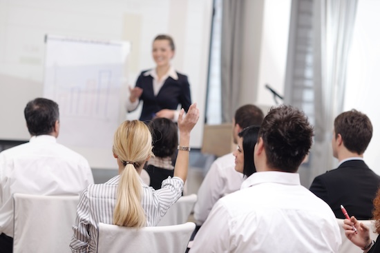 business people group at meeting seminar presentation in brigt conference room @ credit Depositphotos