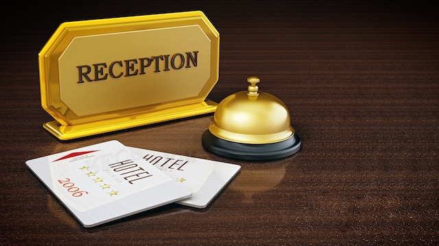 Hotel key card, bell and reception sign on hotel front desk. 3D illustration