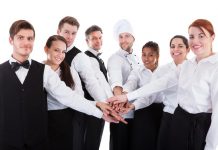 Journal Officiel | Liste des métiers en tension 2025 : ce qu’il faut retenir pour l’hôtellerie-restauration Waiters and waitresses stacking hands