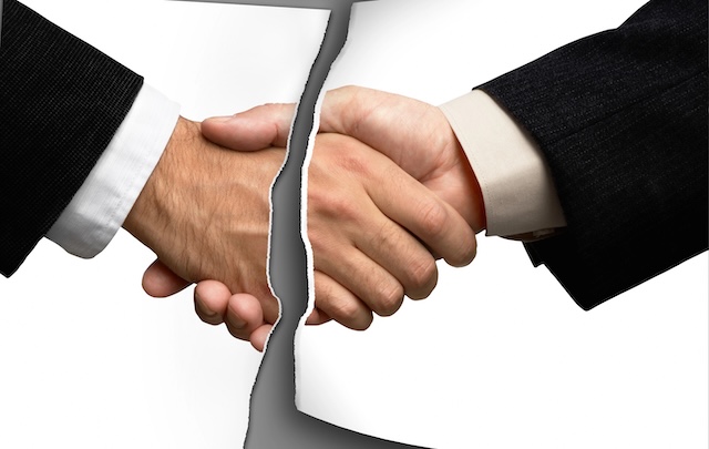 Two businessmen shaking hands @ credit depositphotos.com