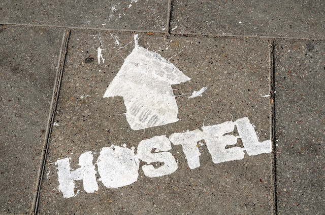 hostel sign with arrow showing direction