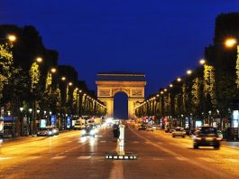 The Champs-Elysees at night in Paris, France